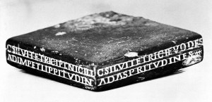 A stamp for stamping lozenges with identification information